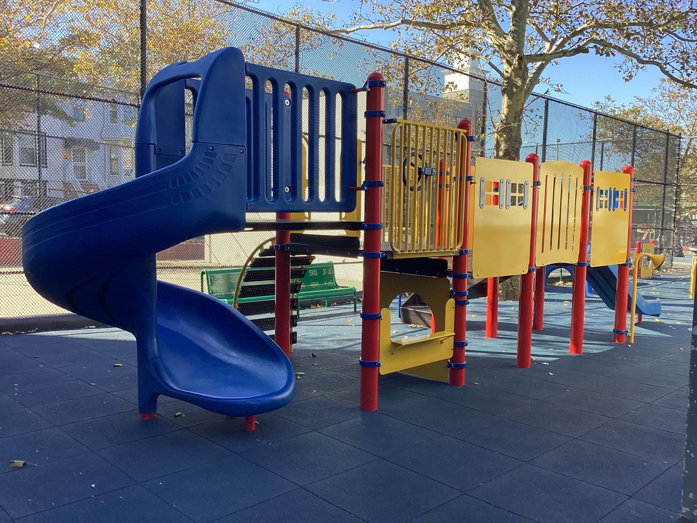 P.S. 001K — Reso A Playground Upgrade — P.S. 001K — completed playground with blue tube slide and multi-deck play structure