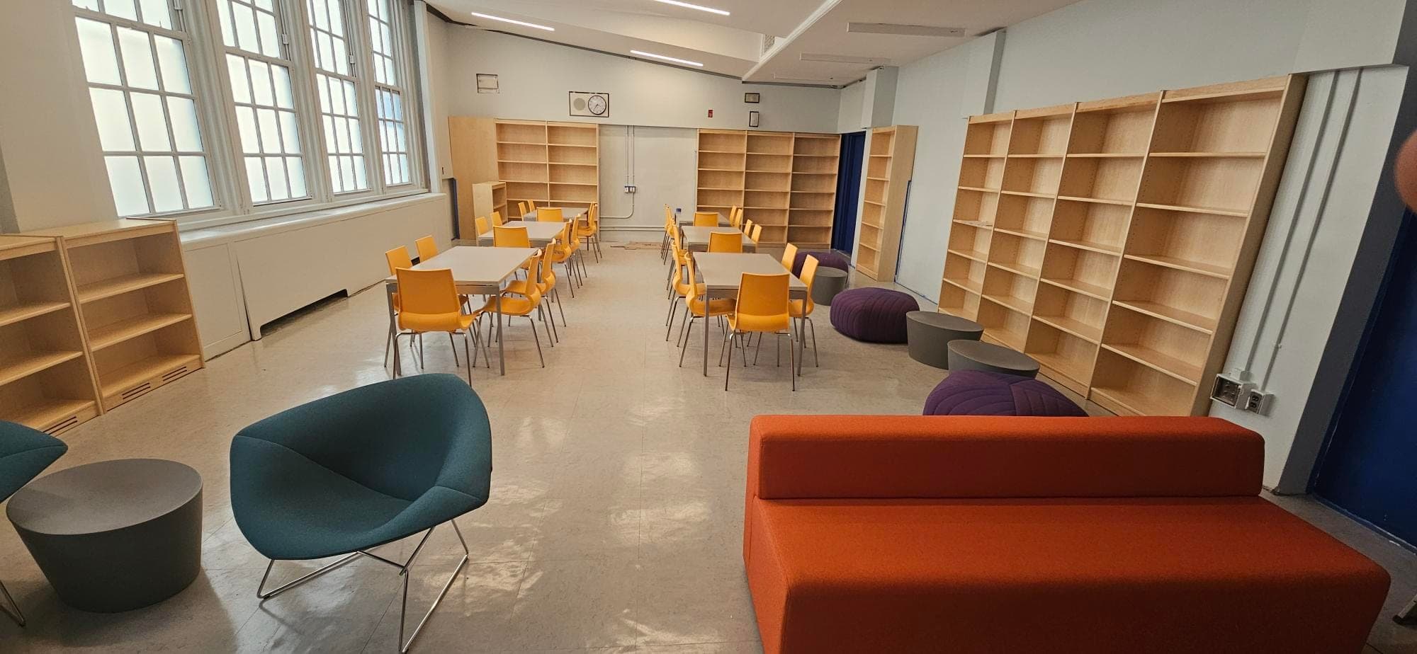 P.S. 70Q — FY20 Reso A Library Upgrade — P.S. 70Q — completed school library with new wood bookshelves, study tables, and modern reading lounge